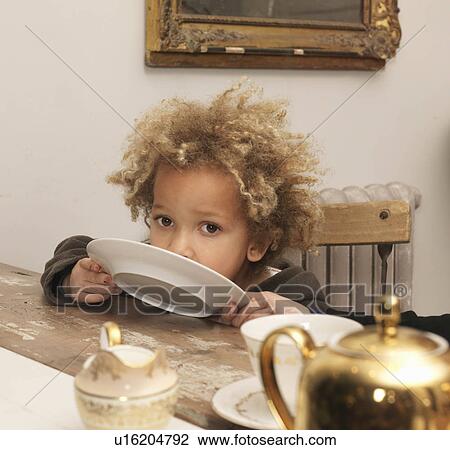 Young boy licking plate View Large Photo Image Stock Image - Young boy licking plate. Fotosearch