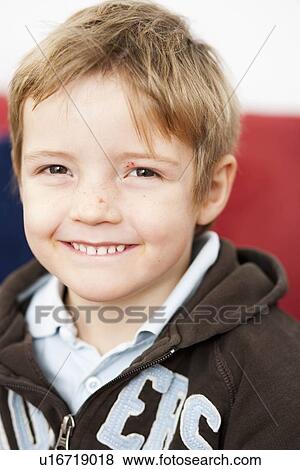 Young boy looking on camera View Large Photo Image Stock Photo - Young boy looking on camera. Fotosearch