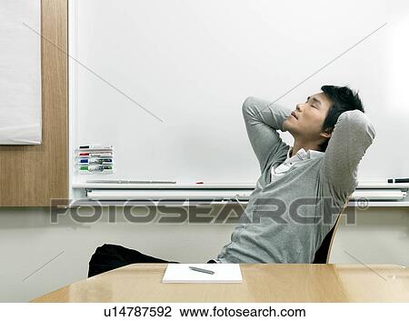 Stock Image - Young business man relaxing. Fotosearch