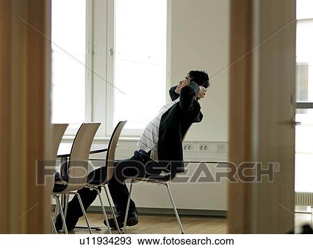 Stock Image - Young business man resting. Fotosearch