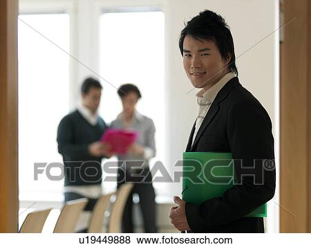 Young business man with folder View Large Photo Image Stock Photo - Young business man with folder. Fotosearch