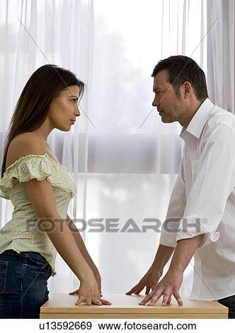 Stock Photo - Young couple at home arguing. Fotosearch