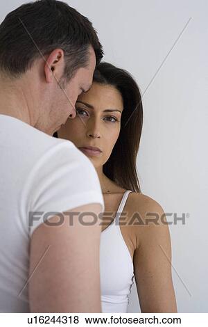Stock Photo - Young couple at home. Fotosearch