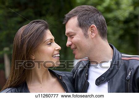 Stock Photo - Young couple outside walking. Fotosearch