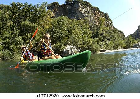 Young girl and mother doing kayak View Large Photo Image Stock Image - Young girl and mother doing kayak. Fotosearch