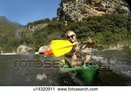 Young girl doing kayak on a river View Large Photo Image Stock Image - Young girl doing kayak on a river. Fotosearch