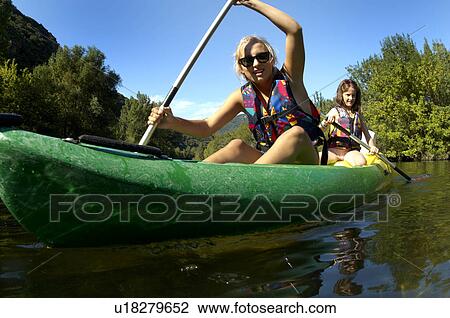 Young girl doing kayak on a river View Large Photo Image Stock Image - Young girl doing kayak on a river. Fotosearch