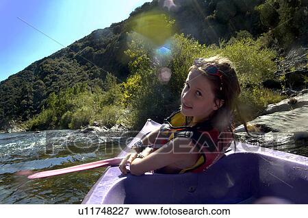 Young girl doing kayak on a river View Large Photo Image Stock Photo - Young girl doing kayak on a river. Fotosearch