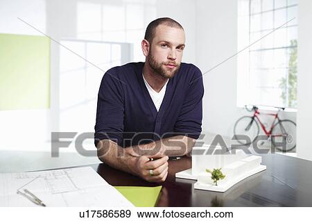 Young male architect in green office View Large Photo Image Stock Photo - Young male architect in green office. Fotosearch