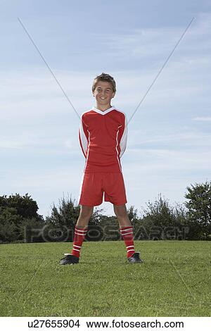 Picture - Young Male footballer standing. Fotosearch