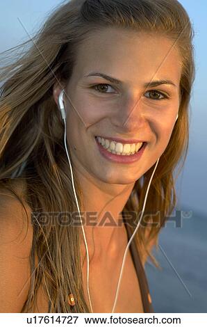 Stock Photo - Young woman at the beach. Fotosearch