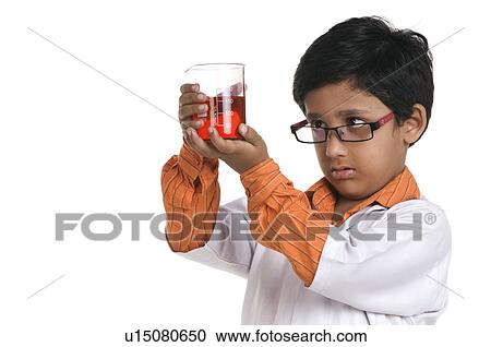 Stock Image - A boy dressed as a scientist. Fotosearch