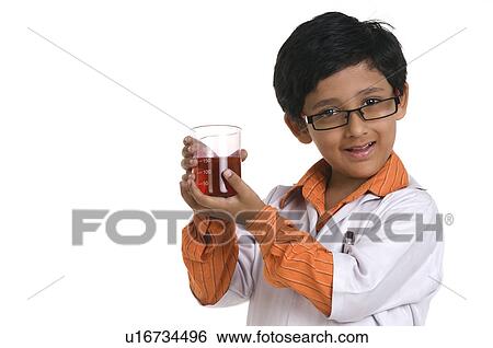 Stock Photograph - A boy dressed as a scientist. Fotosearch