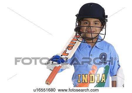 Stock Image - A boy in a cricketer's outfit. Fotosearch