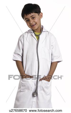 A boy wearing a doctor's coat View Large Photo Image Stock Image - A boy wearing a doctor's coat. Fotosearch