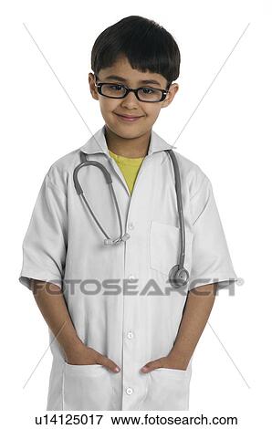 A boy wearing a doctor's coat View Large Photo Image Stock Photo - A boy wearing a doctor's coat. Fotosearch