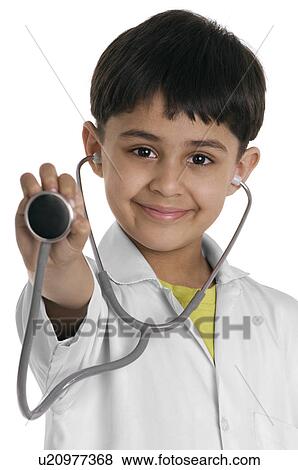 A boy wearing a doctor's coat View Large Photo Image Stock Photo - A boy wearing a doctor's coat. Fotosearch