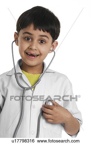 Stock Photograph - A boy wearing a doctor's coat. Fotosearch