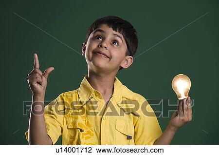 A boy with a bulb View Large Photo Image Stock Image - A boy with a bulb. Fotosearch
