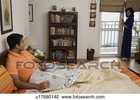 A couple in their bedroom View Large Photo Image Stock Image - A couple in their bedroom. Fotosearch