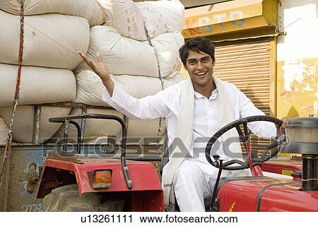 A farmer shows off his sacks View Large Photo Image Stock Image - A farmer shows off his sacks. Fotosearch