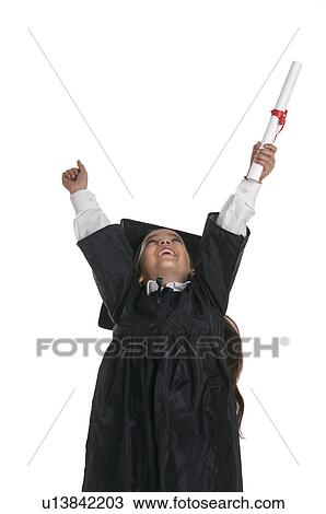 Stock Image - A girl in a graduation gown. Fotosearch