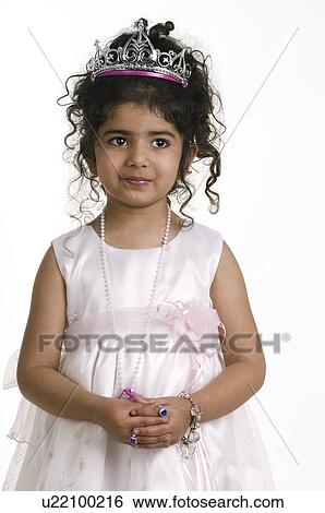 A girl in a party dress and tiara View Large Photo Image Stock Photograph - A girl in a party dress and tiara. Fotosearch