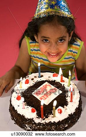 A girl with her birthday cake View Large Photo Image Stock Image - A girl with her birthday cake. Fotosearch