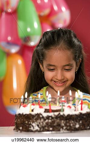A girl with her birthday cake View Large Photo Image Stock Image - A girl with her birthday cake. Fotosearch