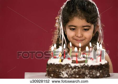 A girl with her birthday cake View Large Photo Image Stock Image - A girl with her birthday cake. Fotosearch