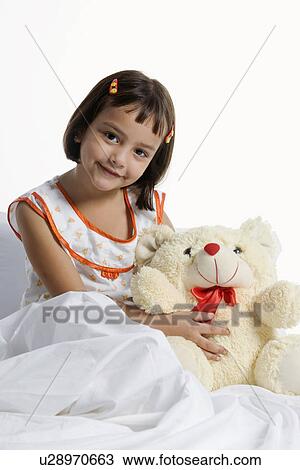 A girl with her teddy bear View Large Photo Image Stock Image - A girl with her teddy bear. Fotosearch