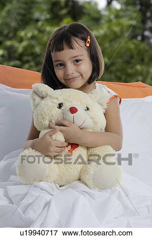 A girl with her teddy bear View Large Photo Image Stock Photo - A girl with her teddy bear. Fotosearch