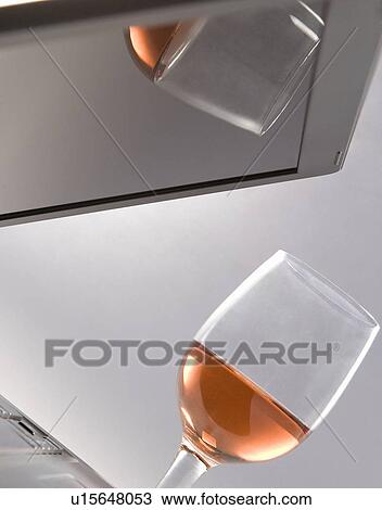 A laptop and a glass View Large Photo Image Stock Image - A laptop and a glass. Fotosearch