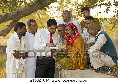 A man explaining to the rural people View Large Photo Image Picture - A man explaining to the rural people. Fotosearch
