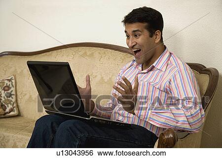 Stock Photograph - A man getting excited. Fotosearch