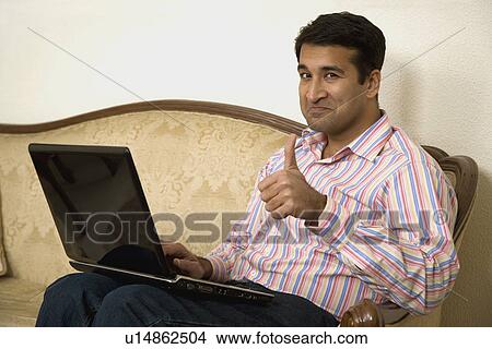 A man giving a thumbs up View Large Photo Image Picture - A man giving a thumbs up. Fotosearch