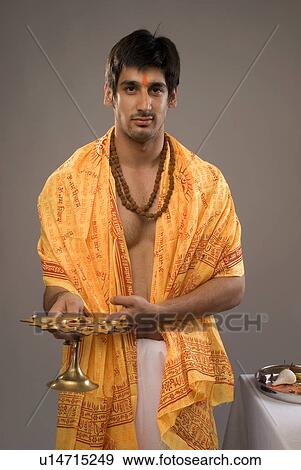 Stock Photo - A man praying. Fotosearch