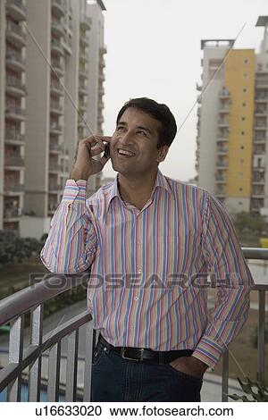 A man talking on his cell View Large Photo Image Stock Image - A man talking on his cell. Fotosearch
