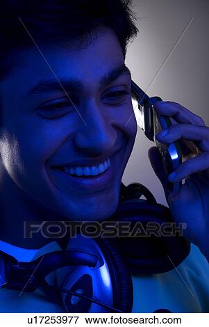 A man talking on his mobile phone View Large Photo Image Stock Photo - A man talking on his mobile phone. Fotosearch