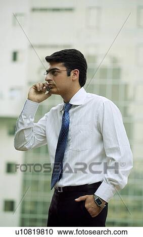 A man talking on mobile phone View Large Photo Image Stock Image - A man talking on mobile phone. Fotosearch