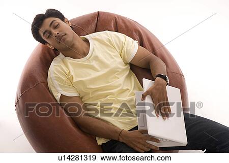 Stock Photo - A man with a laptop. Fotosearch