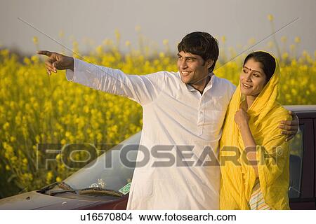 A rural couple in front of their car View Large Photo Image Picture - A rural couple in front of their car. Fotosearch