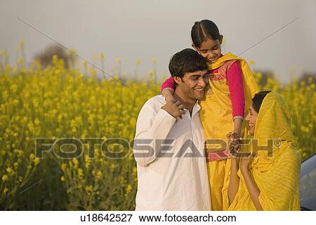 A rural family in front of their car View Large Photo Image Stock Photo - A rural family in front of their car. Fotosearch