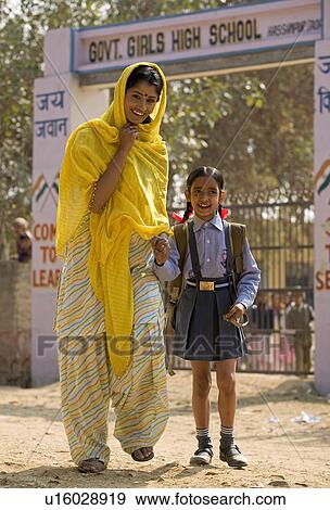 A rural mother picks her child from school View Large Photo Image Stock Photo - A rural mother picks her child from school. Fotosearch