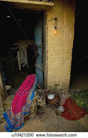 A rural woman in the kitchen View Large Photo Image Stock Image - A rural woman in the kitchen. Fotosearch