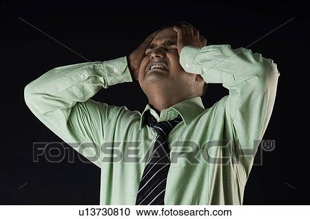 Stock Image - A tensed executive. Fotosearch