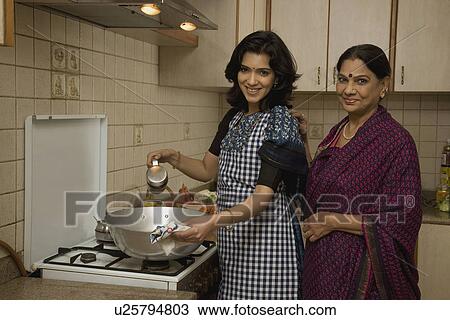 A woman cooking View Large Photo Image Stock Image - A woman cooking. Fotosearch