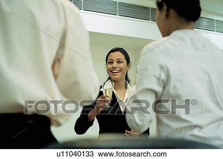 Stock Image - A woman in a meeting. Fotosearch