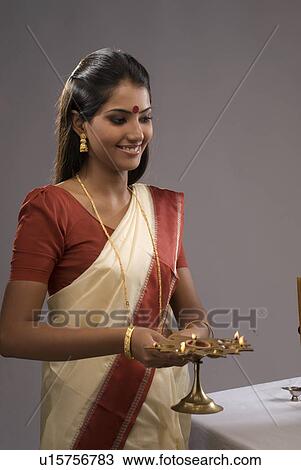 Stock Image - A woman praying. Fotosearch