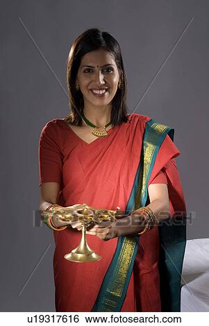 A woman praying View Large Photo Image Stock Photograph - A woman praying. Fotosearch